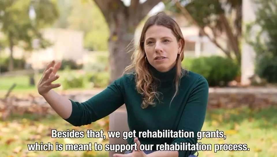 Tamara speaks outdoors in a film about the Fund for Victims of Terror and rehabilitation support.