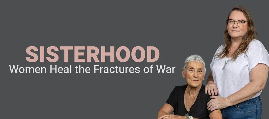 Two women featured in the Sisterhood exhibition, with the title Women Heal the Fractures of War.
