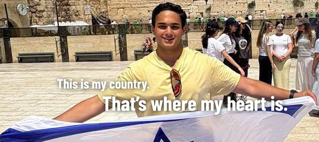 A young person holds an Israeli flag at the Western Wall in Voices from Israel&rsquo;s North.